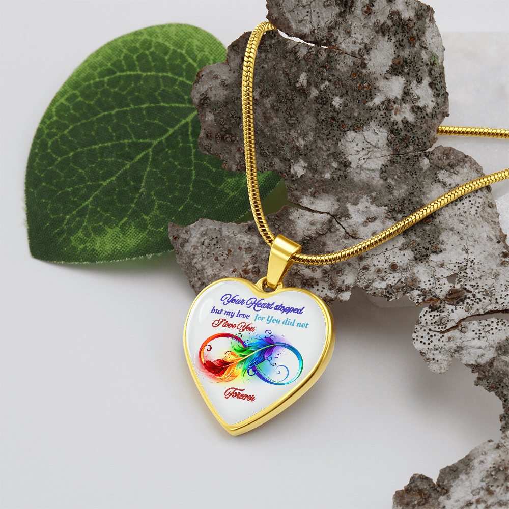 Gold heart-shaped pendant necklace with colorful infinity design and sentimental text.
