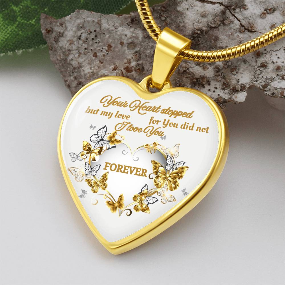 Gold heart pendant necklace with engraved "Your Heart stopped but my love for You did not" and floral design.