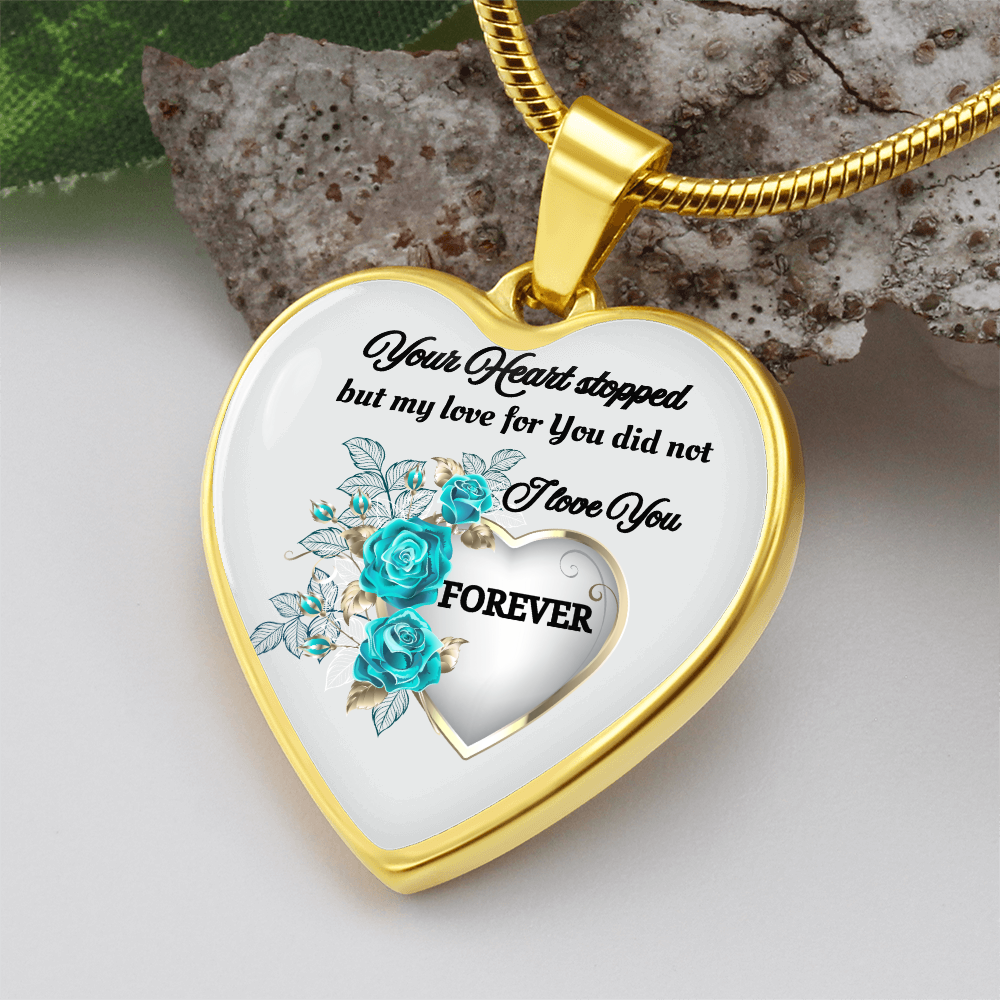 Gold heart-shaped pendant necklace with blue rose design and engraved memorial message.