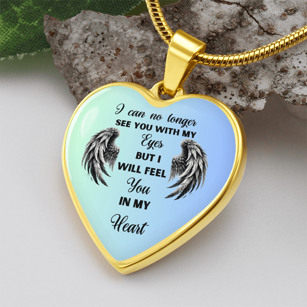 Gold heart-shaped memorial necklace with black angel wings and sentimental engraved message.