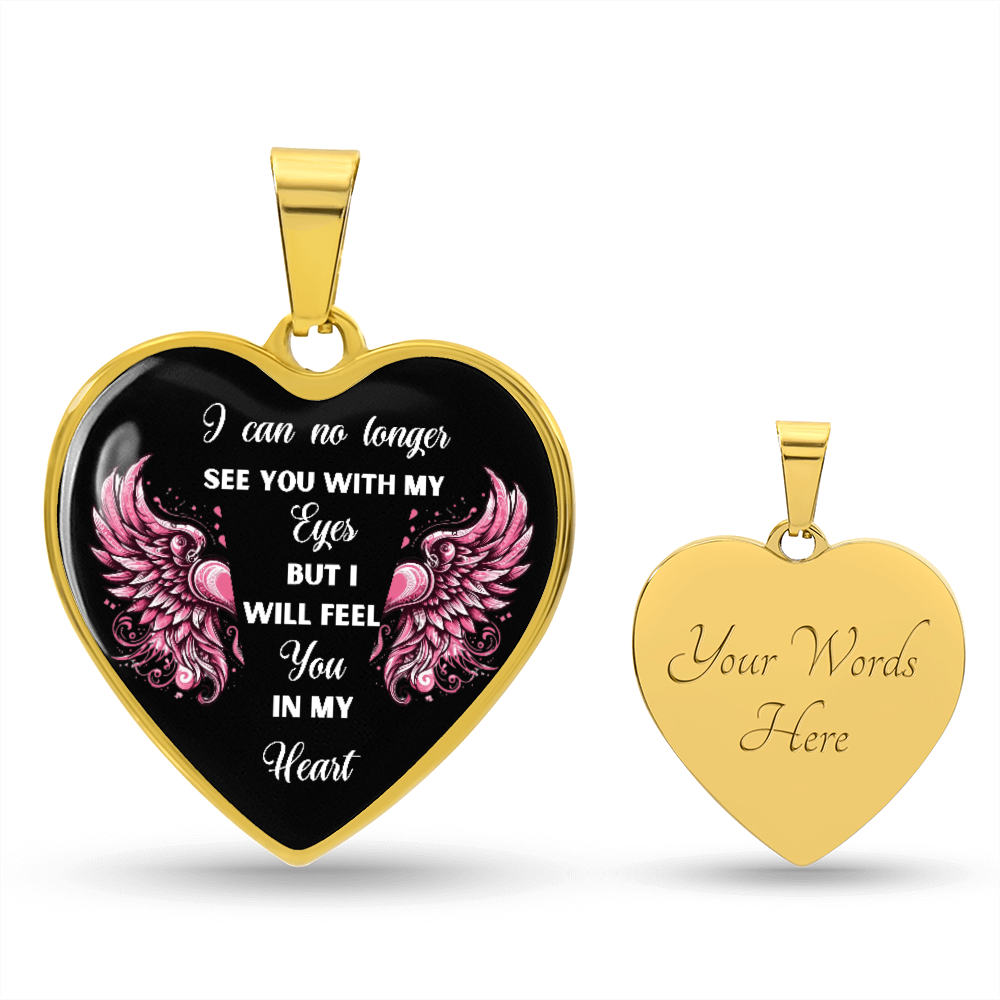 Gold heart-shaped pendant with pink angel wings and engraved sentimental text on black background, matching gold back with.