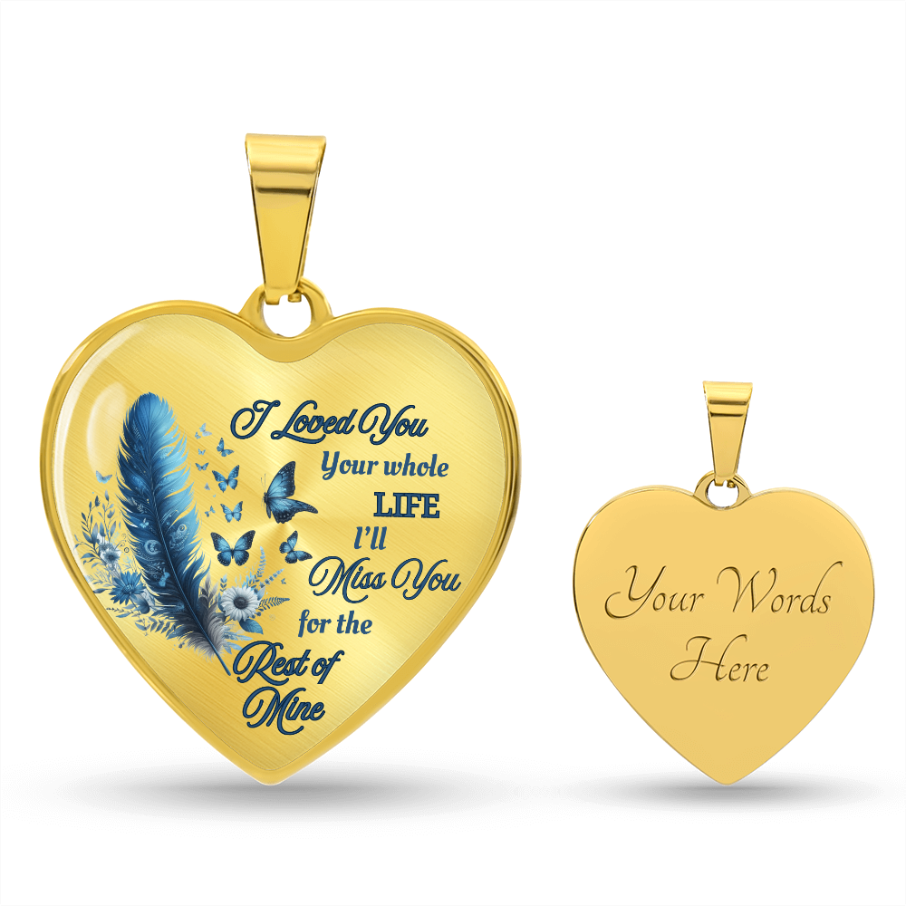 Gold heart-shaped pendant necklace with blue feather and engraved sentimental text on front, personalized engraving on back.