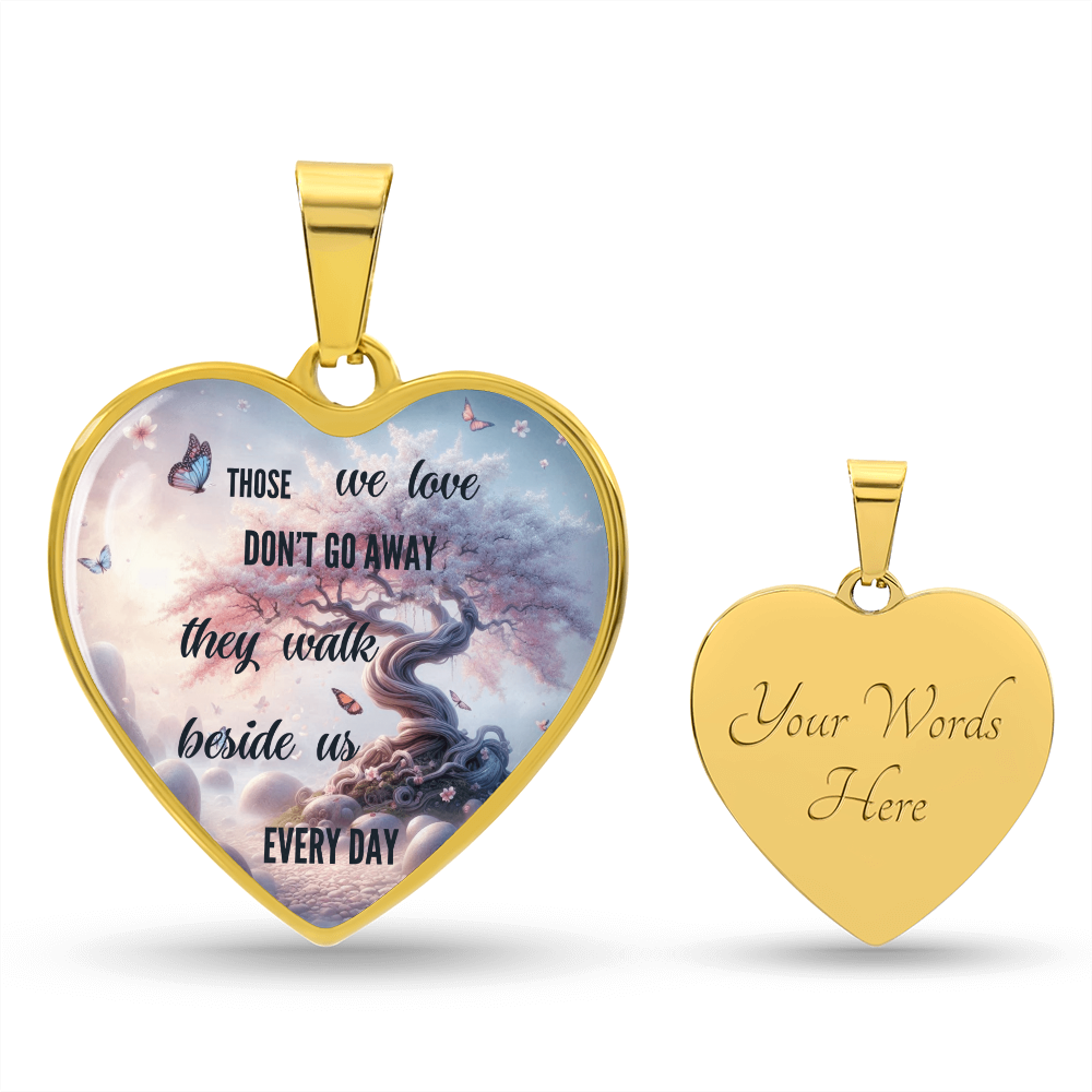 Gold heart-shaped pendant with tree and butterfly design, engraved heartfelt message on front, customizable blank back.