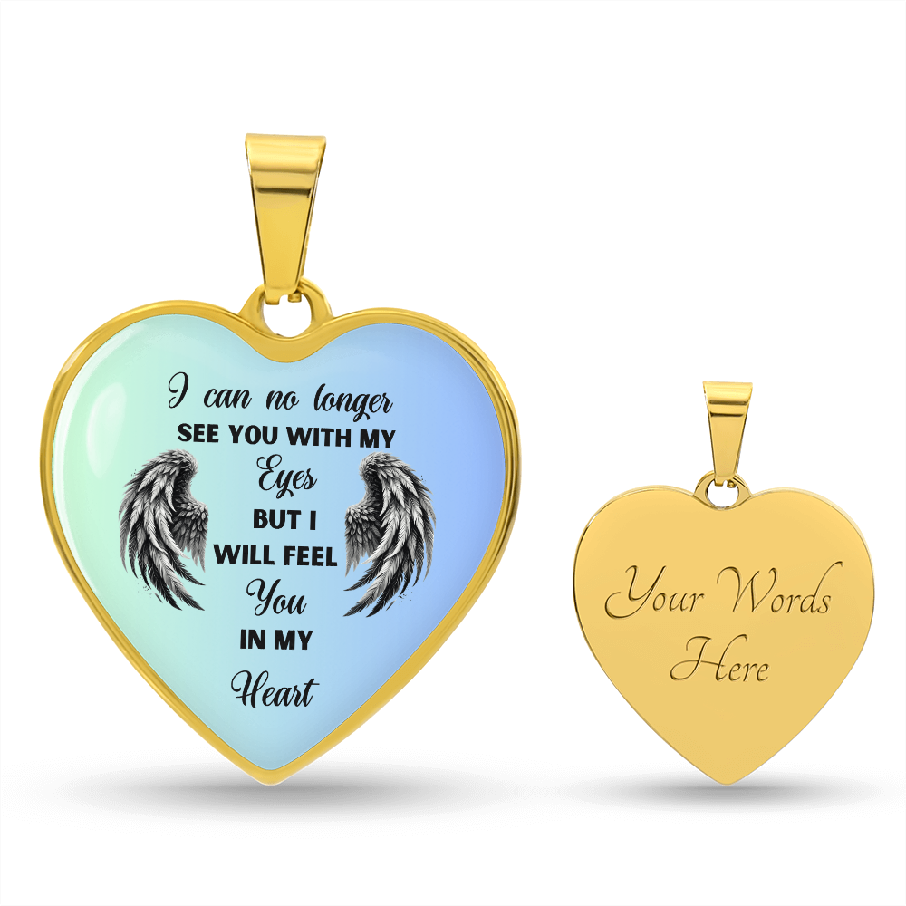 Heart-shaped gold pendant with memorial inscription.