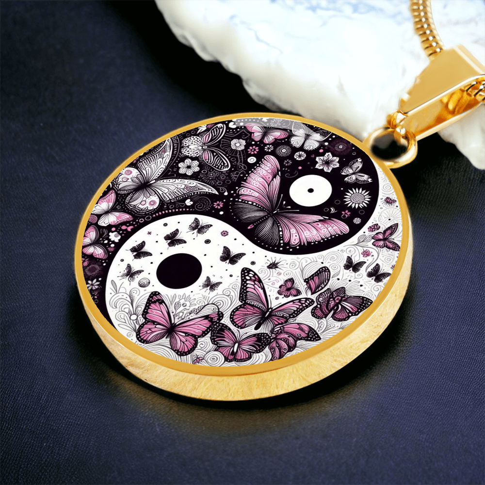 Gold circular pendant featuring a yin yang design with detailed violet butterflies and floral patterns.