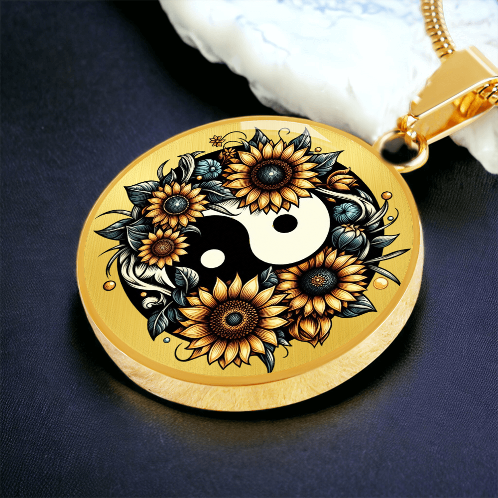 Gold circular pendant necklace with yin yang symbol surrounded by detailed sunflowers and leaves.