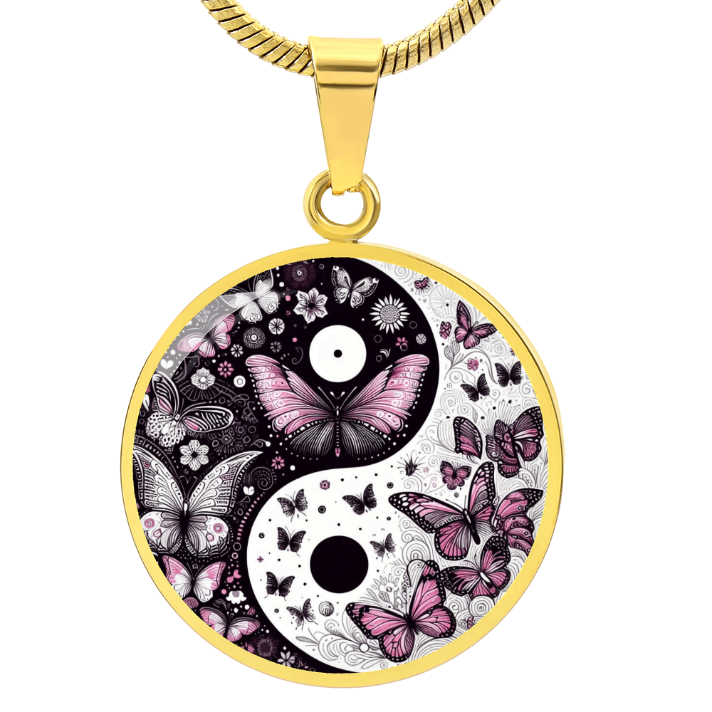 Gold circular pendant with yin-yang design filled with violet butterflies and floral accents.