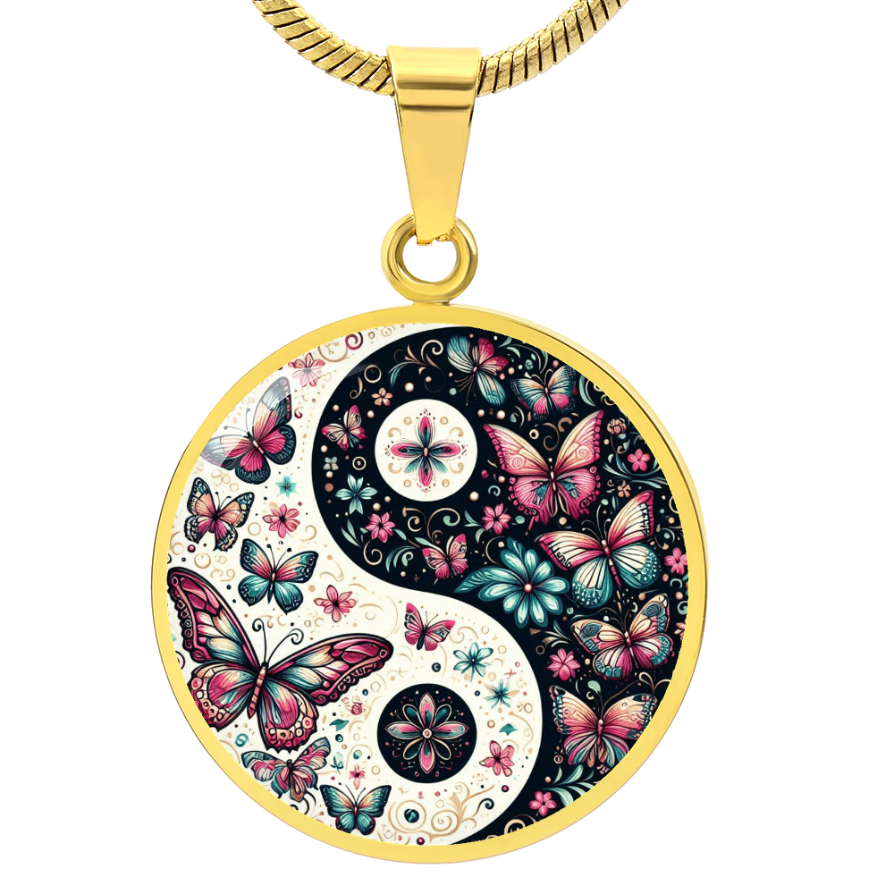 Gold pendant necklace with a yin and yang symbol design featuring butterflies and flowers.