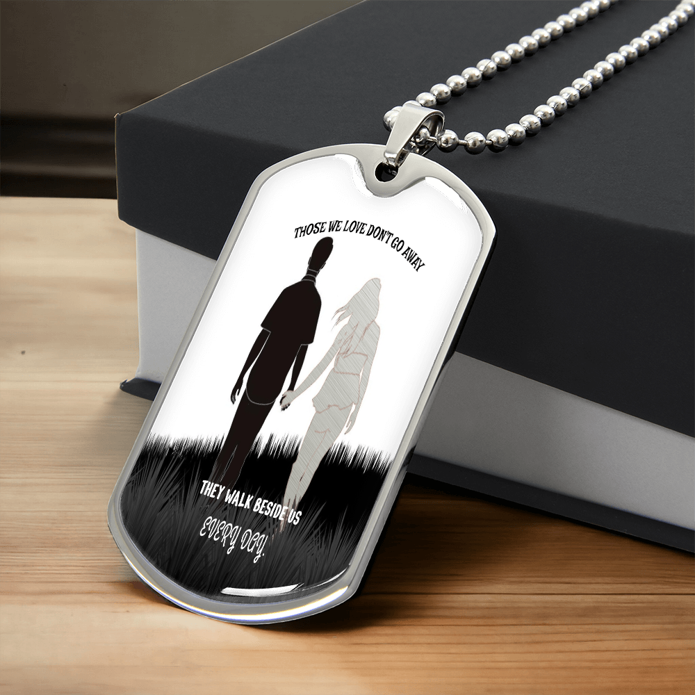 Silver dog tag necklace with engraved silhouette of soldier and woman, remembrance message engraving.