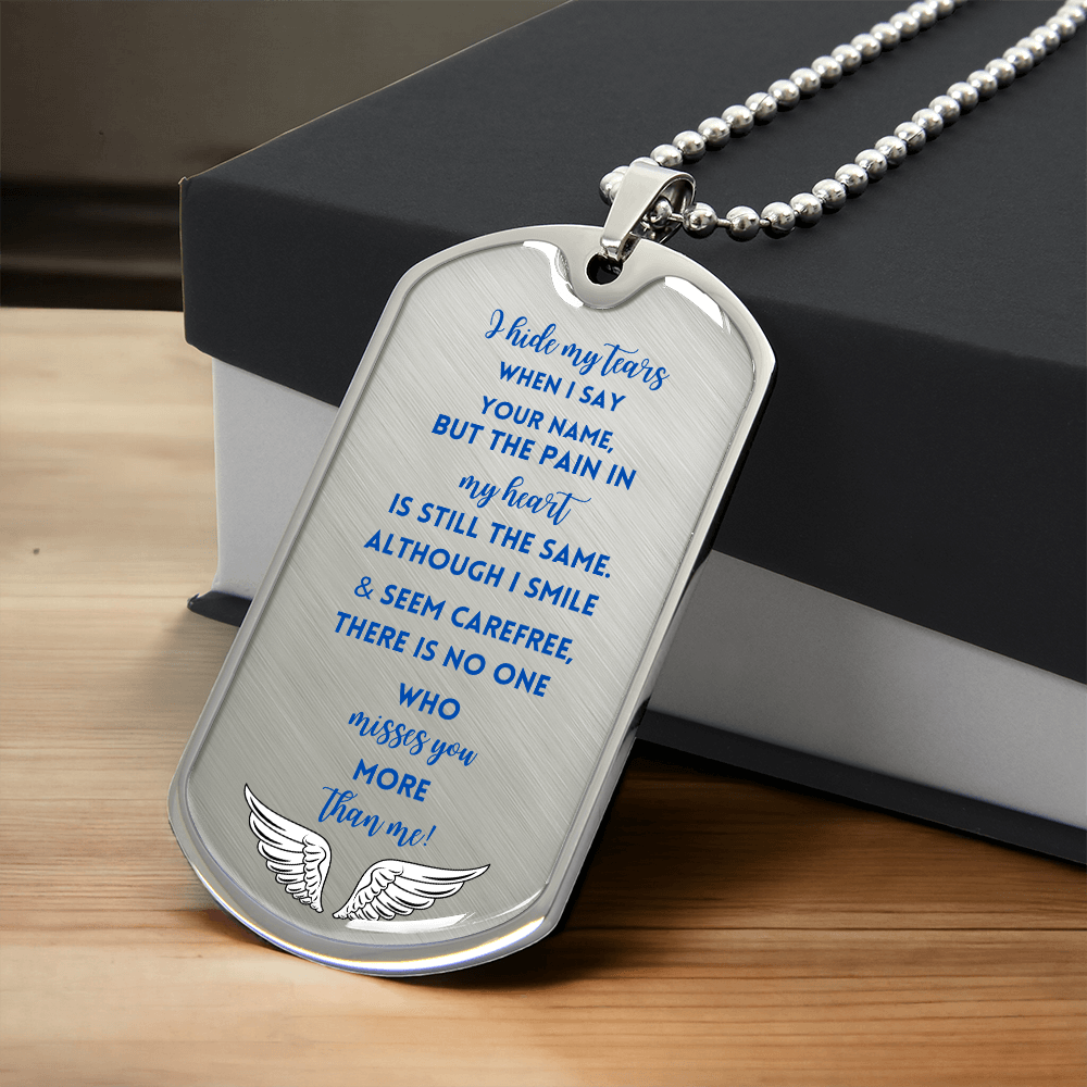 Silver military dog tag necklace with blue engraved memorial poem and angel wings design.