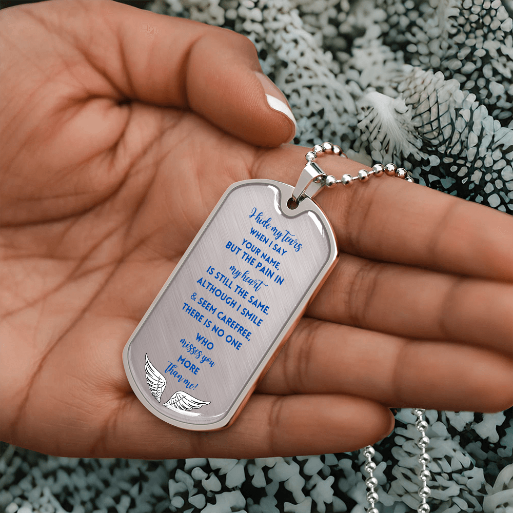 Silver military dog tag necklace with engraved blue memorial poem and angel wings design.