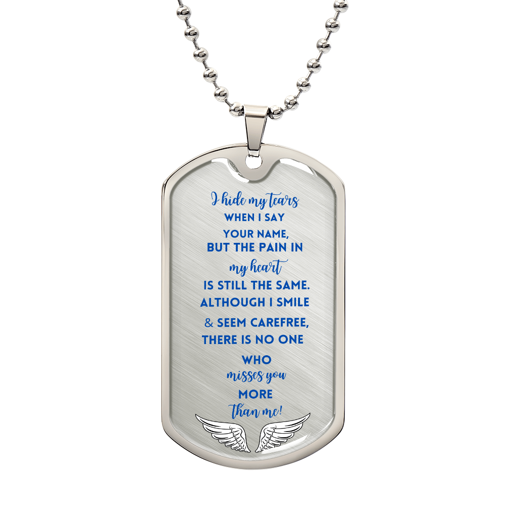 Silver military dog tag necklace with blue memorial poem text and small angel wings engraving at bottom.