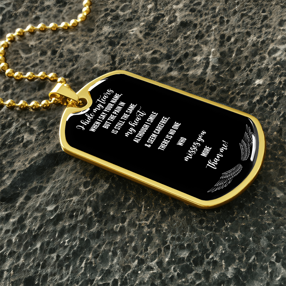 Gold military tag necklace with black face and white grief remembrance text engraving.