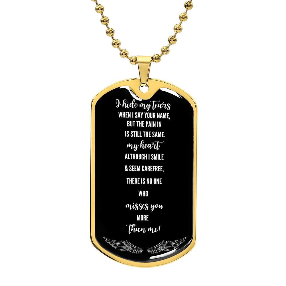 Gold military dog tag necklace with black faceplate engraved with white sentimental poem text and feather design at bottom.