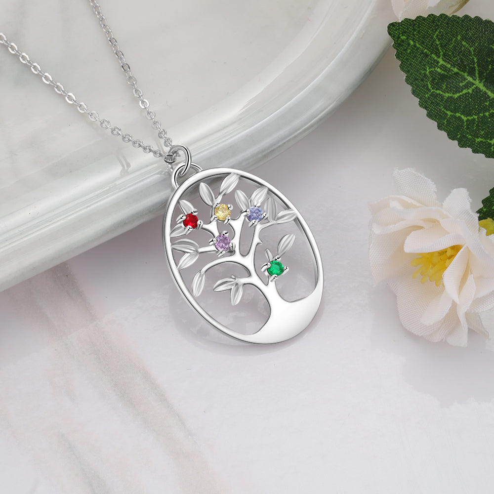 Silver oval family tree necklace with five colorful birthstone charms on a delicate chain.