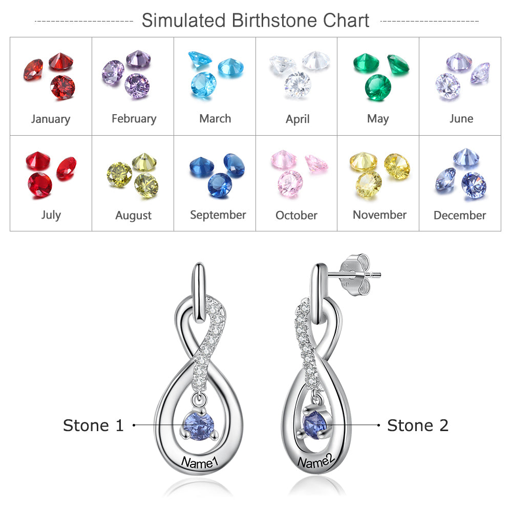 Silver infinity earrings with two custom birthstones and engraved names on each loop.