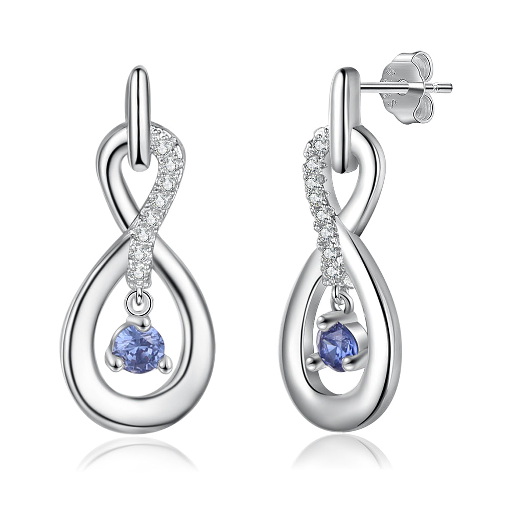 Sterling silver infinity loop earrings with clear crystals and dangling blue birthstone gems.