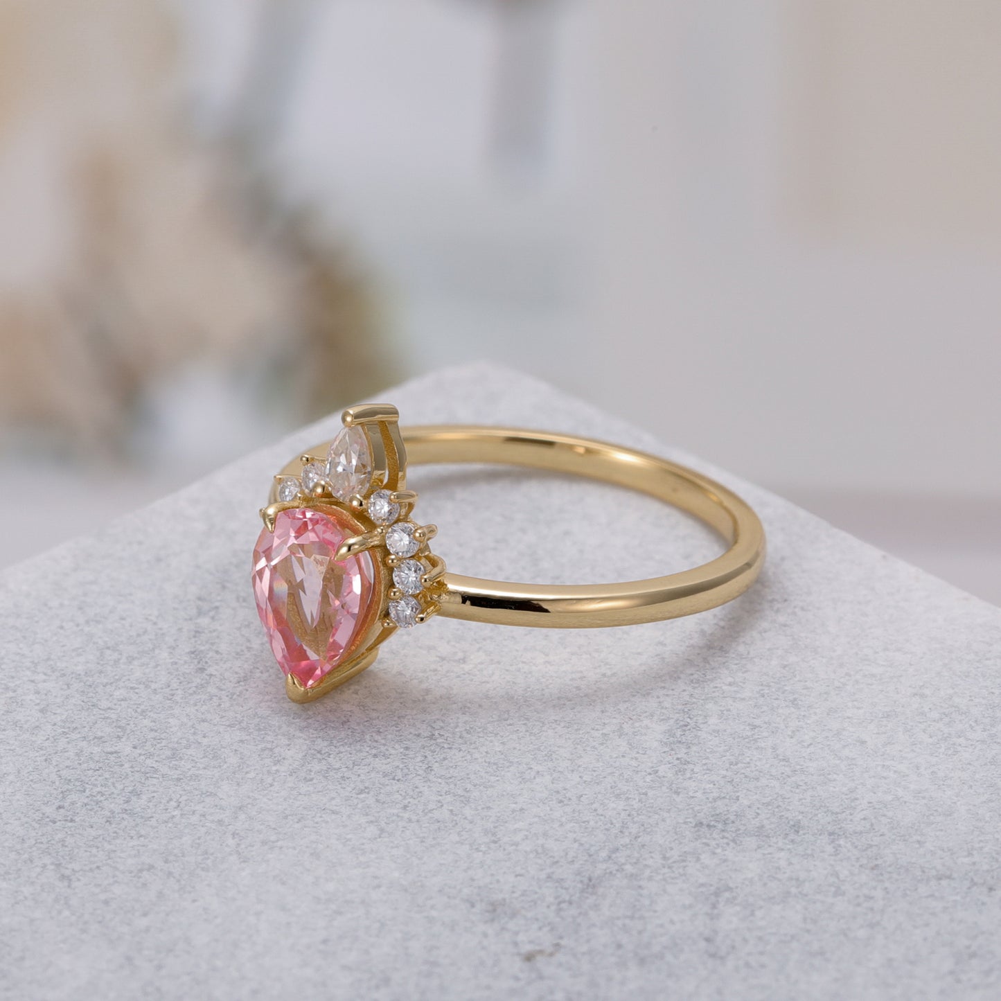 925 Sterling Silver Lab Pink Sapphire Ring with pear-shaped pink sapphire and gold plated band design.
