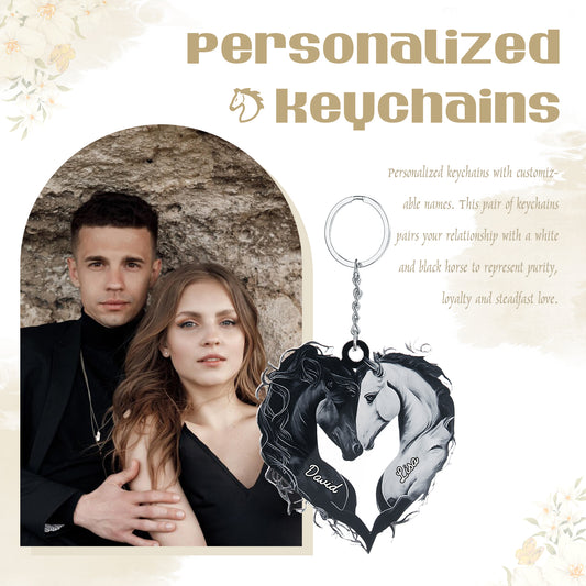Black and white acrylic heart-shaped keychain with two horses forming the heart, customizable name on the charm.