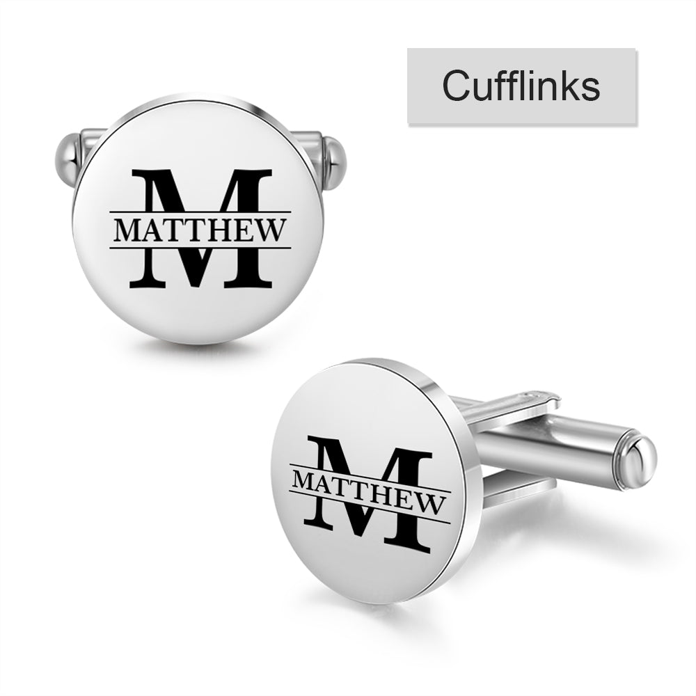 Round silver stainless steel cufflinks with black engraved letter "M" and the name "Matthew" across the center.