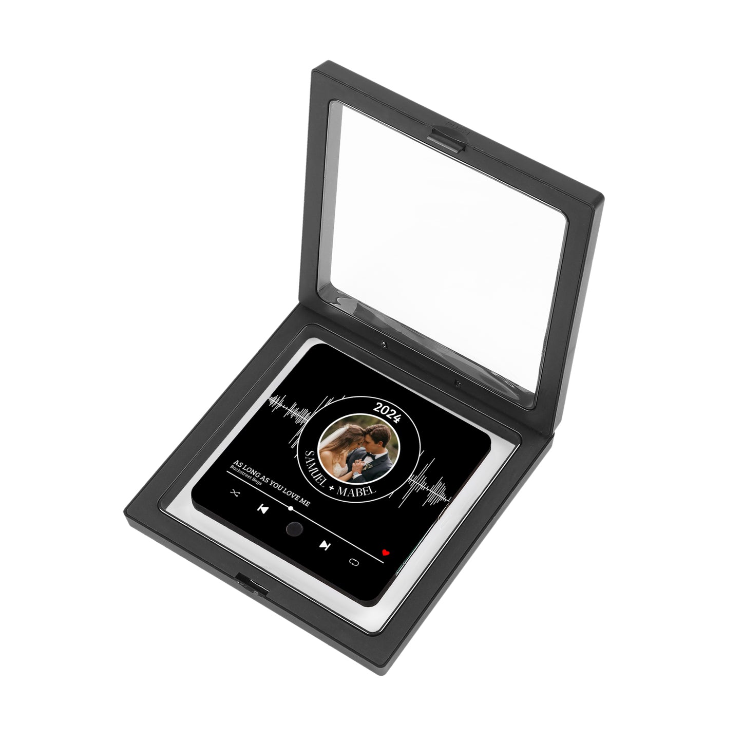 Black display case with a custom-made song plaque inside.