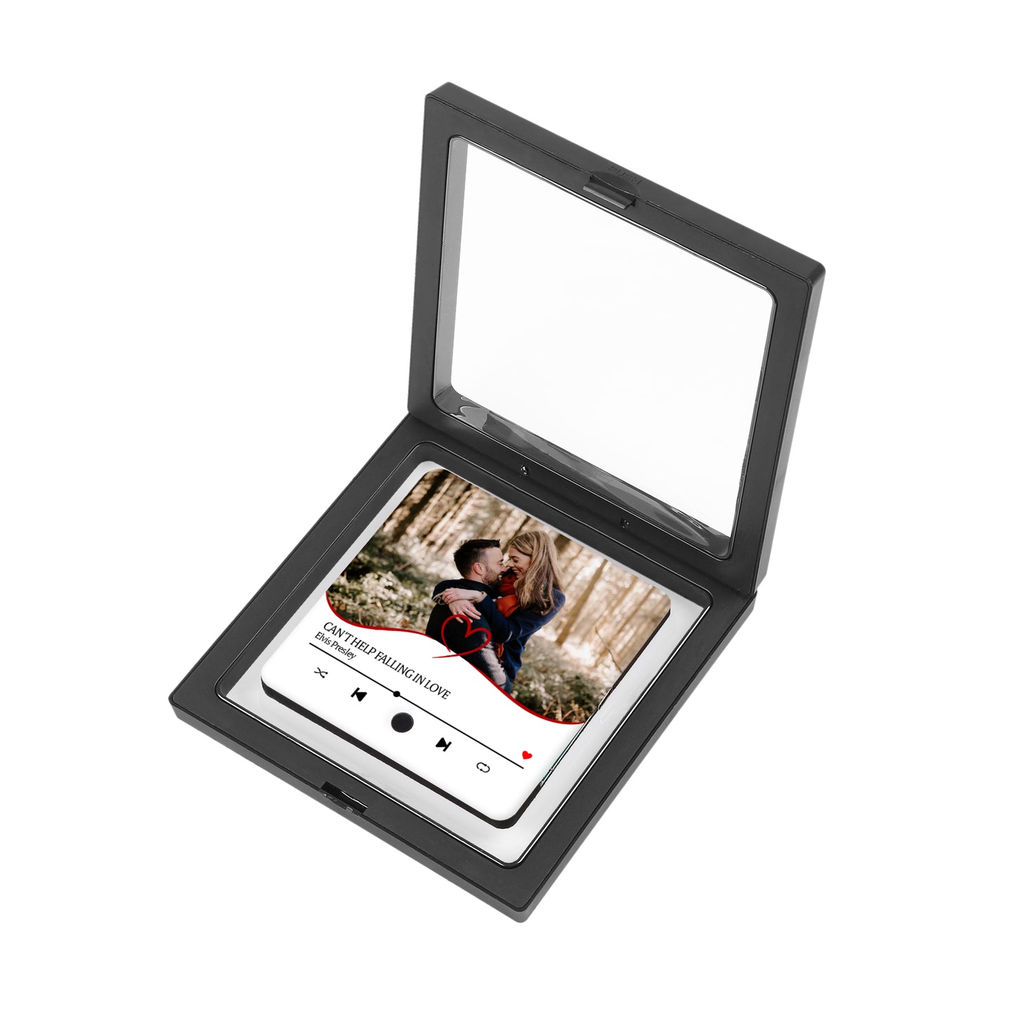 Black display case with a photo of a couple and music player interface.
