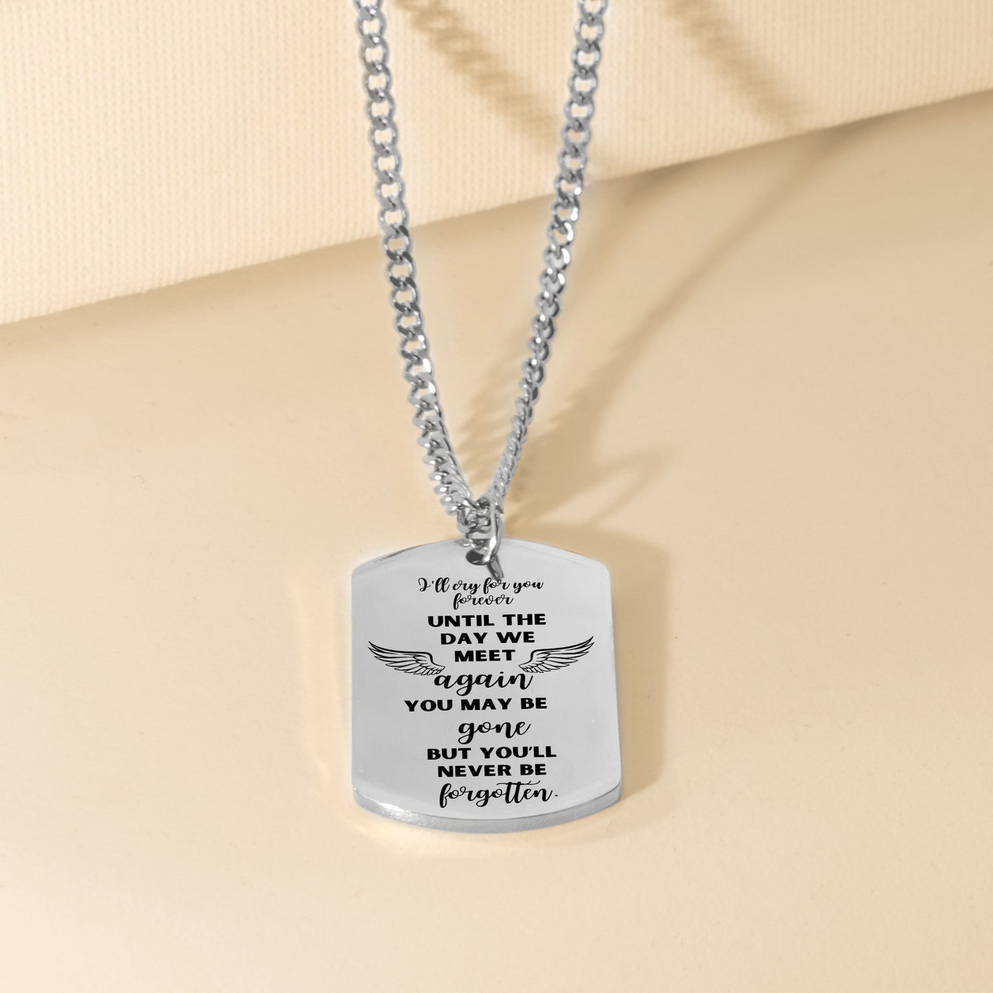 Silver steel dog tag necklace with engraved sentimental message and curb chain.