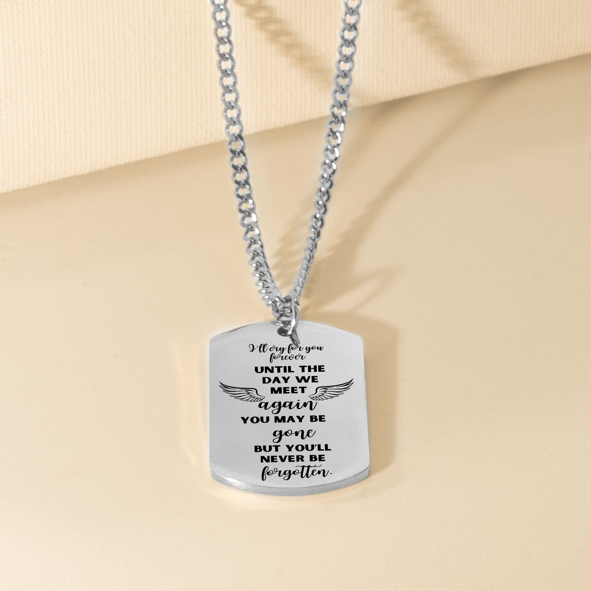 Silver steel dog tag necklace with engraved sentimental message and curb chain.