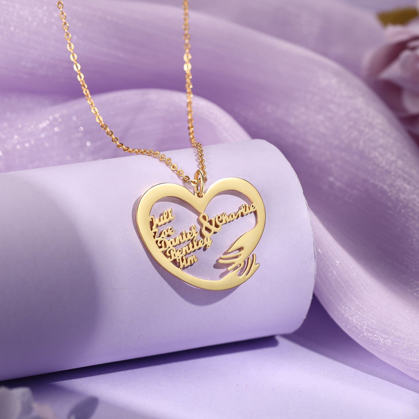 Gold-plated heart-shaped pendant necklace with two hands hugging and custom engraved names.