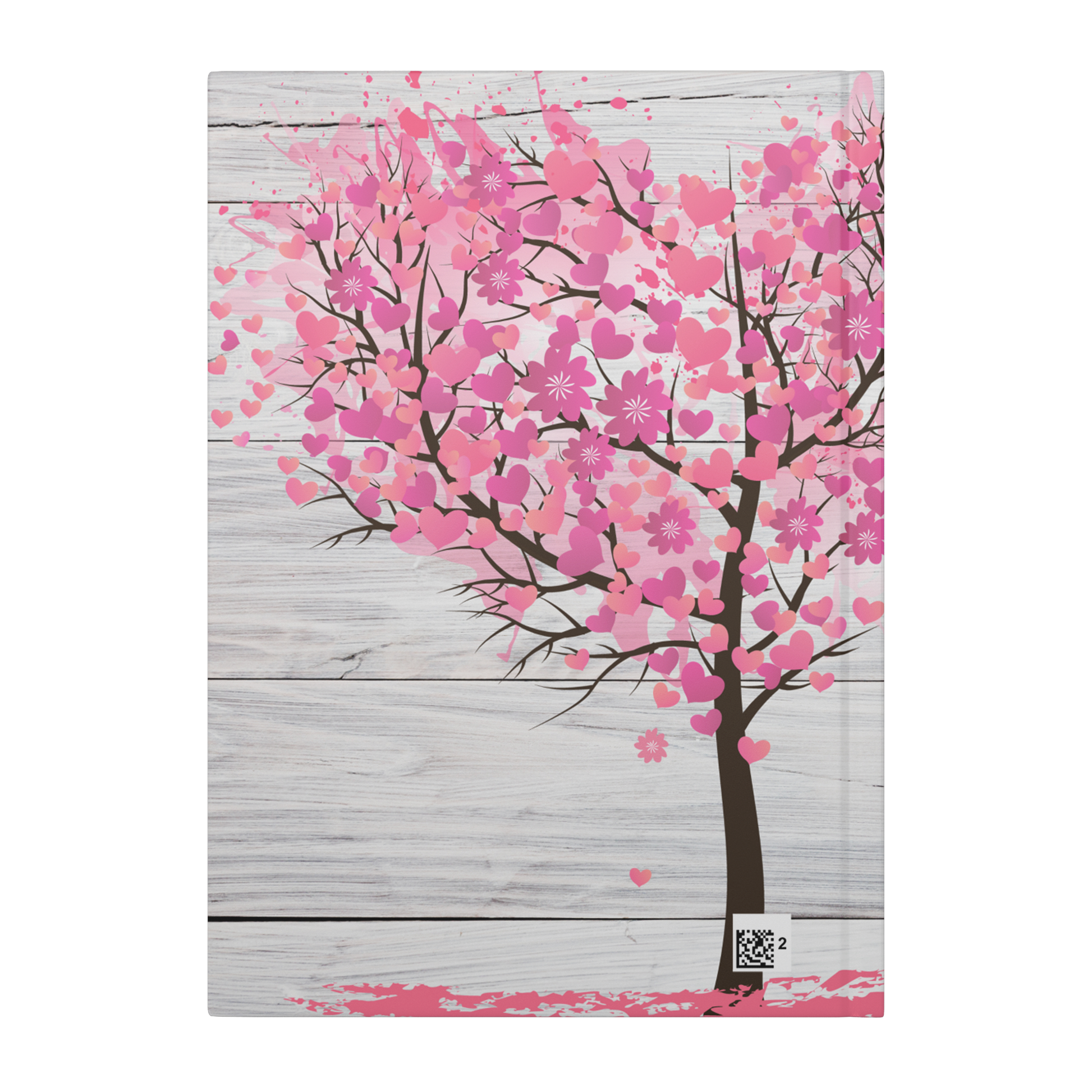 Journal cover with pink cherry blossom tree and heart-shaped petals on a whitewashed wooden background.