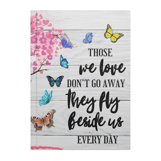 White wooden journal cover with colorful butterflies and pink heart blossoms, black script text "Those we love don't go.