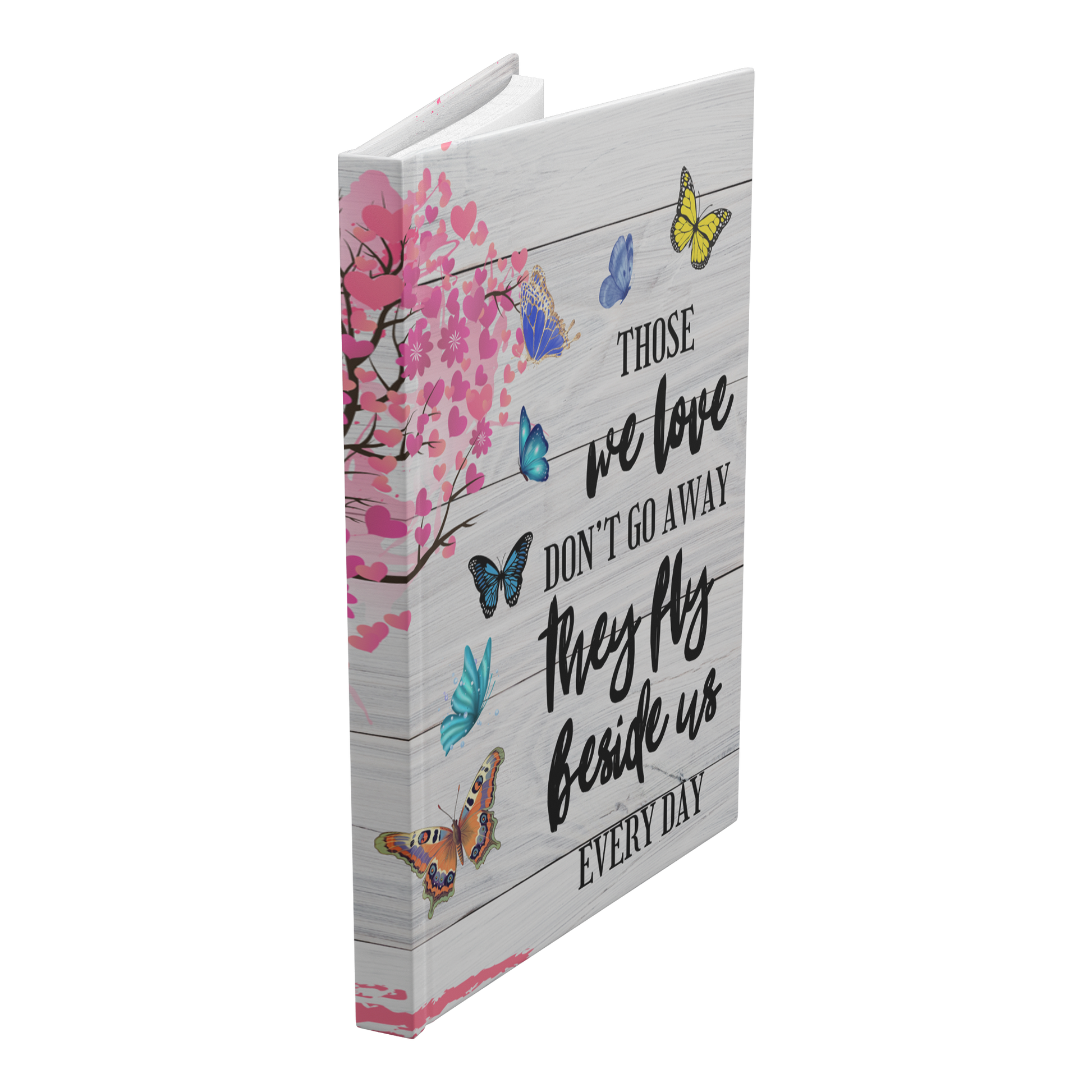 White wooden plank journal with pink tree, butterflies, and quote in black script font on cover.