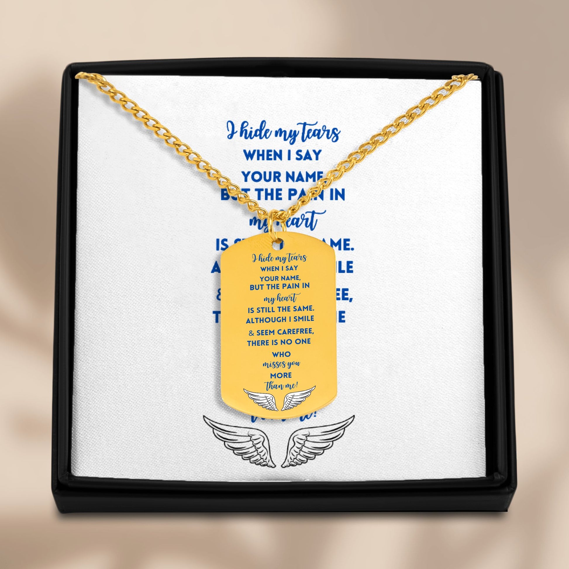 18k gold-plated memorial dog tag necklace with engraved sympathy poem, displayed in black gift box with winged emblem under.